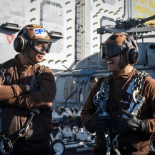PACIFIC OCEAN (Dec. 3, 2016) Seaman George Sablan, left, and Seaman Abraham Alvarez, both assigned to the Gray Wolves of Electronic Attack Squadron (VAQ) 142 stand on the flight deck of the aircraft carrier USS Nimitz (CVN 68). Nimitz is currently underway conducting Tailored Ship's Training Availability and Final Evaluation Problem (TSTA/FEP), which evaluates the crew on their performance during training drills and real-world scenarios. Once Nimitz completes TSTA/FEP they will begin Board of Inspection and Survey (INSURV) and Composite Training Unit Exercise (COMPTUEX) in preparation for an upcoming 2017 deployment. (U.S. Navy photo by Petty Officer 2nd Class Siobhana R. McEwen/Released)
